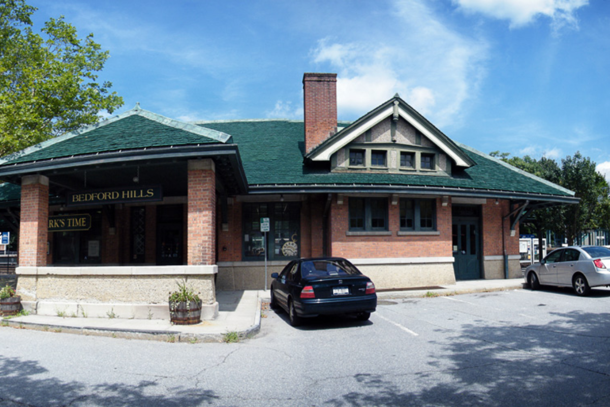 Illustrated Bedford Hills roundtable discussing hamlet revitalization, vacant storefronts, the train station, sidewalks, small businesses, and practical local action.